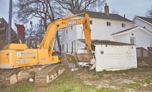 A John Deere Tractor Shovel, owned by Mike Coates Construction Co. of Niles, was stolen and used to
damage a vacant home in Niles. Police believe two men are involved in Monday’s early-morning rampage,
using the company’s tractor to destroy both commercial and residential property.