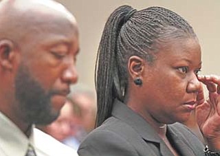 Trayvon Martin’s mother, Sybrina Fulton, and father, Tracy Martin, attend a House Judiciary Committee briefing on racial profiling and hate crimes on Tuesday on Capitol Hill in Washington.