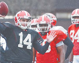 With Kurt Hess firmly entrenched as the starter and Marc Kanetsky graduated, Pat Angle (14) has the early edge on redshirt freshman Dante Nania for the job as backup quarterback for the Youngstown State Penguins come fall.