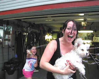 Madalyn Smith sprays her mom, Allison Smith, with Silly String. They’re both from Boardman. Photo submitted by Grandma Patty Hoover.
