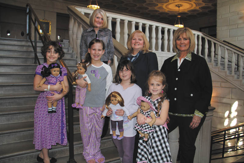 Four of the young girls who will participate as models in the American Girl Doll Fashion Show presented by Kids’ Crew of Akron Children’s Hospital Mahoning Valley on April 28 and 29 at Stambaugh Auditorium are, left to right, Andrea Dull, 8, of Hubbard, Olivia Cmil, 8, of Boardman, Zoe Simon, 9, of Poland and Paige Fluent, 5, of Poland. Behind them are, from left to right, Gayle Kelly, chairman of Kids’ Crew, JoAnn Stock of Akron Children’s Hospital and Betty Cmil of Kids’ Crew.
