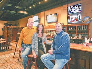 Wolves Den business partners Rick Racik, left, Stacey Rzonsa and Joseph Rzonsa at the Creekside Golf Dome in Girard.