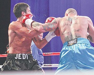 Youngstown’s Kelly “The Ghost” Pavlik lands a left hook on the jaw of Aaron “Jedi” Jaco in the second
round of their super middleweight bout Saturday at the Alamodome in San Antonio, Texas. The shot
knocked Jaco to the canvas and earned Pavlik a win by TKO.