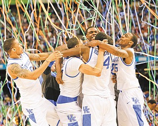 Kentucky players celebrate following their 67-59 victory over Kansas for the NCAA basketball championship at the Superdome in New Orleans. Anthoyn Davis, who finished with six points, 16 rebounds, five assists, six blocked shots and three steals in the championship game, was named the tournament’s Most Outstanding Player.