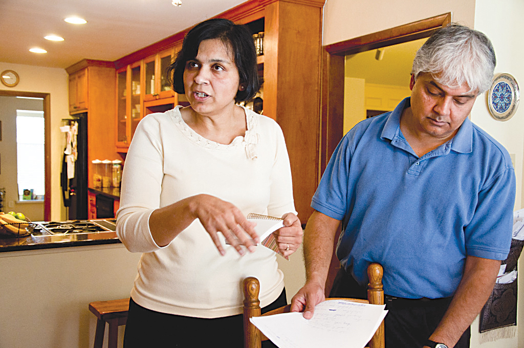 Ranjana Bhandari, left, and Kaushik De have lived off Division Street in Arlington, Texas, for 19 years. It was a nice place, they said. Now they fear for their family’s health because of the numerous gas wells.