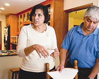 Ranjana Bhandari, left, and Kaushik De have lived off Division Street in Arlington, Texas, for 19 years. It was a nice place, they said. Now they fear for their family’s health because of the numerous gas wells.