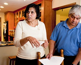 Ranjana Bhandari, left, and Kaushik De have lived off Division Street in Arlington, Texas, for 19 years. It was a nice place, they said. Now they fear for their family’s health because of the numerous gas wells.