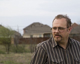 Gary Hogan stands in his Fort Worth neighborhood where fracking was introduced with no warning — just clanking steel and screeching brakes on the property behind his home. Work continued that first day until 3 a.m. Hogan and his councilman vowed it would not happen again to others, and the nation’s first city ordinance on fracking were born. The Fort Worth laws have been a template for other cities.