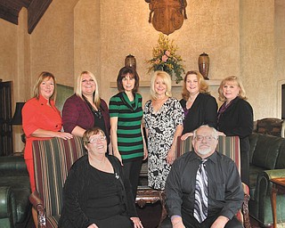 Photo by Robert K. Yosay | The Vindicator: JoAnn and Barry Claycomb, seated, advocate funding and awareness campaigns to help those living with Alzheimer’s, which includes Barry. Committee members involved with the eighth annual Forget-Me-Not fundraiser for the Alzheimer’s Association are, from left to right in the back row, Jacki Jones, Fury Kuzma, Pam Rogers, Johanna Nuzzo, Christina Pallo and Helen Paes. A Valley physician, Dr. Charles Wilkins, and the Claycombs will be honored at the gala event for their dedication to the Alzheimer’s cause.