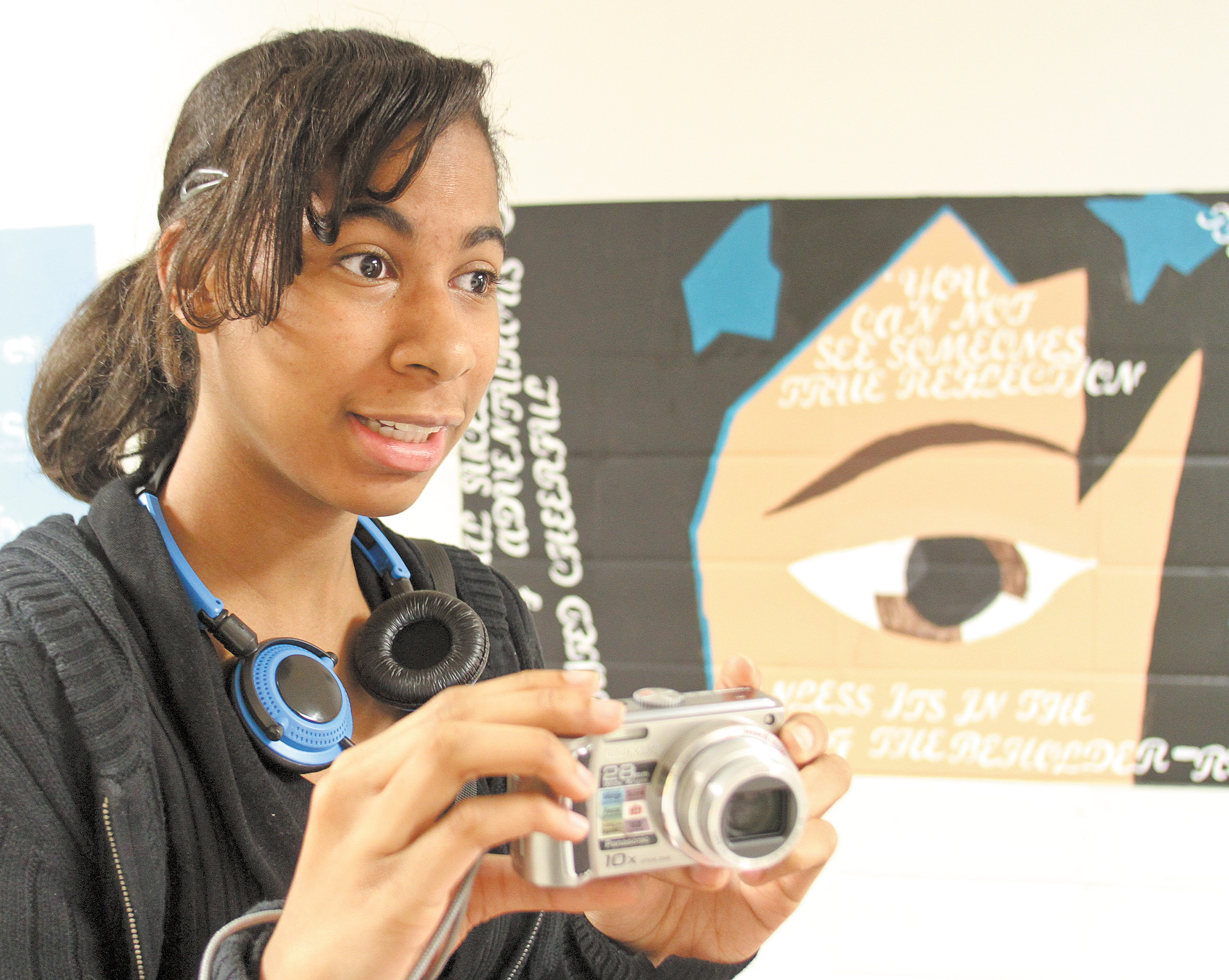 Youngstown Early College student Torri Session shoots video for the school’s online yearbook during an open house Thursday at the school. The open house was part of YEC’s National Early College High Schools Week observance.