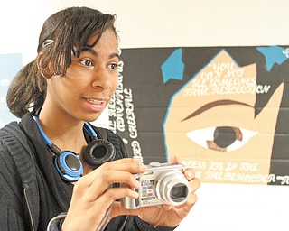 Youngstown Early College student Torri Session shoots video for the school’s online yearbook during an open house Thursday at the school. The open house was part of YEC’s National Early College High Schools Week observance.