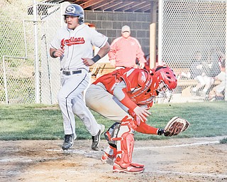 Girard’s Dan Graziano (2) crosses home plate to score as the ball is thrown past LaBrae catcher Blake Sprague during Thursday’s baseball game at Tod Park in Girard. The Indians capitalized on six Vikings errors to win 7-2.