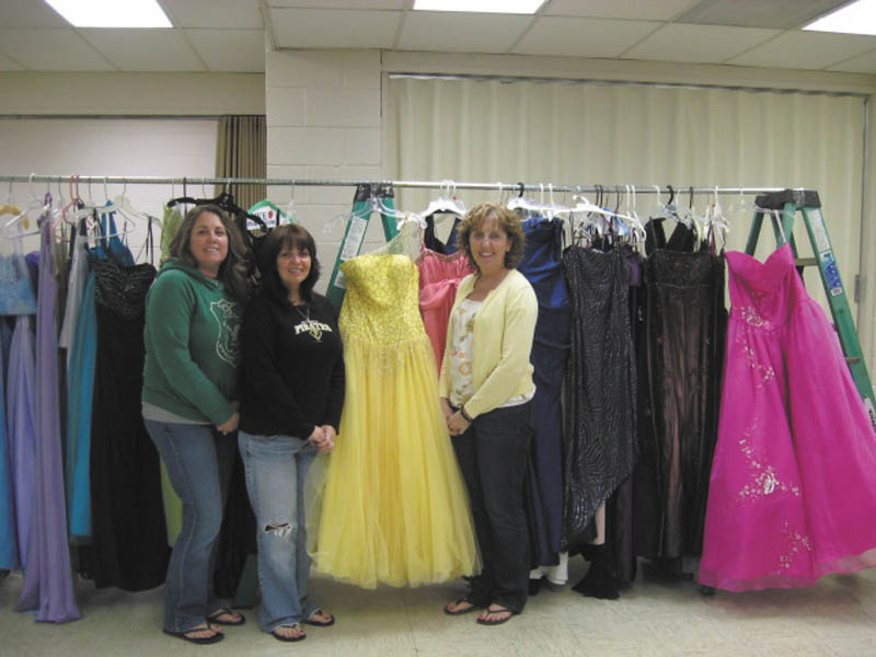 Boardman Evangel Baptist Church, 5248 Southern Blvd., Boardman, will host its first prom dress giveaway from noon to 4 p.m. Saturday. Organizers have collected more than 100 dresses, and there also will be shoes and jewelry. They are pleased to be able to offer participants an opportunity to enjoy prom without the costs associated with it. Displaying some of the dresses are, from left, Lisa Rohrman, Angela Ford and Lynda Hawkins. High school girls are encouraged to come early to try on their favorite gently worn dresses.