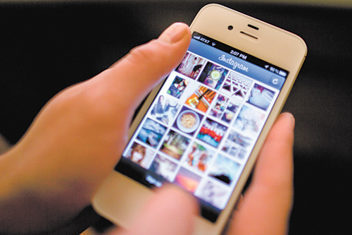 Instagram is demonstrated on an iPhone in New York. Facebook is spending $1 billion to buy the photo-
sharing company Instagram in the social network’s largest acquisition ever. Instagram lets people
apply filters to photos they snap with their mobile devices and share them with friends and strangers.