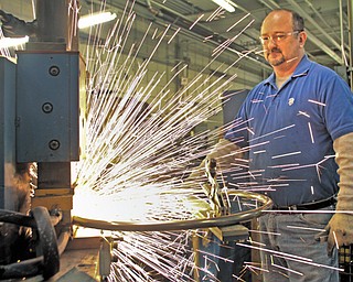 Mark Fuller, one of about 125 employees at Mahoning Valley-based Gasser Chair, welds a chair part. Gasser makes all of its furniture at its Liberty Township and Holmes County, Ohio, facilities.
