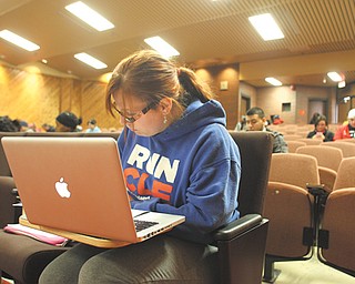 Youngstown State University student Sara Weigel of Poland takes notes during a class in a lecture hall/auditorium inside DeBartolo Hall on campus. Auditoriums inside DeBartolo, Cushwa and Ward-
Beecher halls are being updated starting next month.
