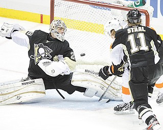 The Pittsburgh Penguins’ Jordan Staal (11) watches as the Philadelphia Flyers’ Jakub Voracek, back right, scores the game-winning goal past Penguins’ goalie Marc-Andre Fleury (29) during the overtime period in Game 1 of the Eastern Conference quarterfi nals Wednesday at Consol Energy Center in Pittsburgh. The Flyers won 4-3 to grab a one-game lead in the series.