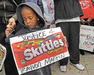 Steven Jonhson, 3, holds an enlarged banner of Skittles candy as he joins Los Angeles community
members at a “Justice for Trayvon Martin hoodie rally” to protest the death of Trayvon Martin, an
unarmed black teenager who was shot and killed by neighborhood watch captain George Zimmerman.