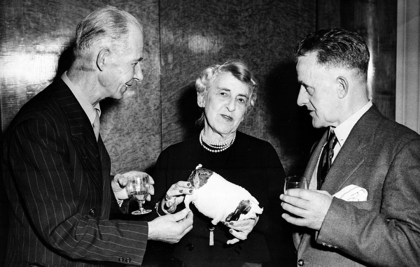 Survivors of the Titanic, from left, Reginald Burgess, 64, from Southampton, Edith L. Russell, from Cincinnati, Ohio, USA, and Edward Ryan, from Hull, Yorkshire, are shown in this undated photo at the Odeon Theatre, Leicester Square, London, England.  The trio and eleven other survivors are attending a reception in connection with the film, "A Night to Remember" that is to be filmed by the Rank Organization.  Russell, a fashion journalist and a first-class passenger on the Titanic, is holding the "lucky pig" that she had taken with her on the ill-fated voyage.  Burgess was a chef's assistant and Ryan a passenger on the ocean liner that sank April 15, 1912.  (AP Photo)