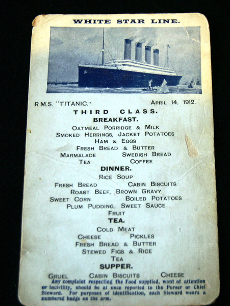 An original Titanic third class menu postcard is seen at the Larz Anderson Auto Museum in Brookline, Mass., Sunday, May 1, 2005.  Detailing the meals available on April 14, 1912 is seen on one side of the card. The item will be auctioned off with other rare Titanic relics at the Museum. (AP Photo/Chitose Suzuki)