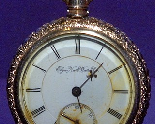 This pocket watch was recovered from the body of American postal clerk John Starr March, one of five mail clerks who died in the sinking of the RMS Titanic, and is on exhibit at the Natonal Postal Museum in Washington Friday Sept. 17, 1999.  March and four colleagues gave their lives trying to save heavy bags of mail on the doomed RMS Titanic; the "RMS" stood for Royal Mail Steamer. (AP Photo/J. Scott Applewhite)