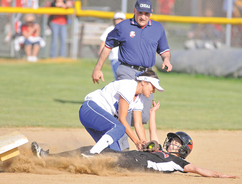 Poland’s Kalie Benson puts the tag on Canfield’s Alexa Bodine, who was safe trying to reach second base during their game at Canfield High. The Bulldogs scored five runs in the top of the seventh inning to pull away for the 9-2 victory over their rivals.