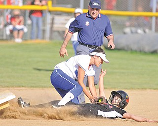 Poland’s Kalie Benson puts the tag on Canfield’s Alexa Bodine, who was safe trying to reach second base during their game at Canfield High. The Bulldogs scored five runs in the top of the seventh inning to pull away for the 9-2 victory over their rivals.