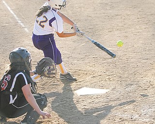 Champion’s Haylee Gardiner (22) connects for a hit in the bottom of the third inning of Wednesday’s softball game against Mathews in Champion. The Golden Flashes blasted the Mustangs, 15-0, behind Gardiner, who cracked a three-run home run in the first inning, and teammate Lindsay Swipas, who tossed a five-inning, 12-strikeout no hitter.