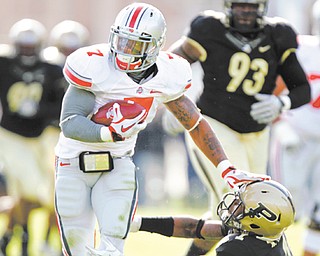 Buckeyes running back Jordan Hall (7) welcomes the opportunity to be the featured back at Ohio State. Short in
stature, he figures to play a big role in the Buckeyes hurry-up offense.