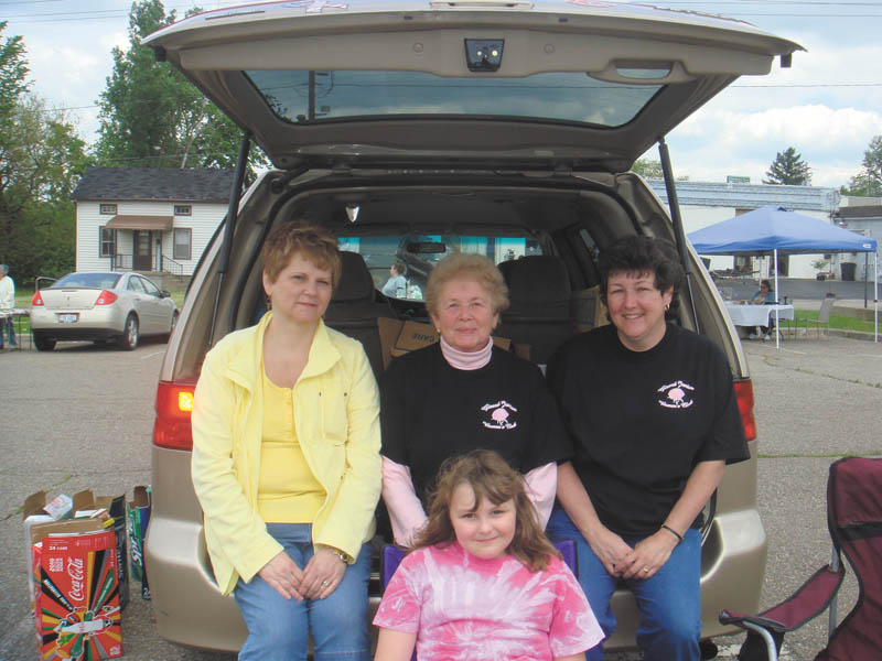 Girard Junior Women will sponsor a trunk sale from 10 a.m. to 2 p.m. May 12 in the Girard City parking lot, across the street from the Girard City Hall/Justice Center. Preparing for the sale are, from left, Kathy Rossell, Martha Altiere and Laura Sobnosky (and her daughter.) The public is invited to buy or sell items, and spaces to set up a table or sell directly from a car trunk are $10. There also will be a special sale table of items donated by the group. All proceeds will benefit the Girard community. For table reservations call 330-545-5962.