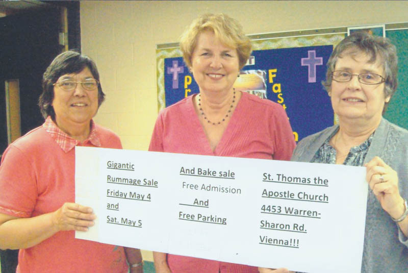 The Women’s Altar and Rosary Guild of St. Thomas the Apostle Church (formerly St. Vincent de Paul), 4453 Warren-Sharon Road, Vienna, will sponsor its annual rummage sale from 10 a.m. to 4 p.m. May 4 and from 9 a.m. to 2 p.m. May 5. Holding a banner listing the details are, from left, Florence Gordon, treasurer; Pat Slavin, project chairwoman and secretary; and Dianne Setterberg, guild co-president. The sale will include household and kitchen items, linens, crafts, children’s clothes, small furniture, jewelry, books and more. There will be free admission and parking, and Saturday will be half-price day.