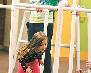 Medelyn Huffman, 3, of Hubbard runs through connective tubing, part of a new exhibit in OH WOW! The Roger and Gloria Jones Children’s Center for Science and Technology’s “Who Knows” exhibit. The Home Depot stores of Austintown and Boardman partnered with OH WOW! to contribute and install the new exhibit.