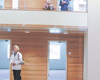 The $1.7 million reconfiguration of the Ursuline Sisters of Youngstown’s Motherhouse includes common areas
that will be used for socialization and relaxation once the area is completed. Architects came up with a plan in which two sections of the floor were removed from the second floor, opening up a two-story atrium that allows light to shine down into the lower level.