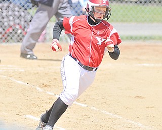 Youngstown State senior Haley Thomas rounds first base on her way to second during the first game of a doubleheader against the University of Illinois-Chicago on Sunday at McCune Park in Canfield. The Penguins split with the Flames, dropping the first game 11-8, but winning the nightcap 9-7. Thomas went 4-for-8 on the day to tie the team’s single-season hits record of 64 set by Amanda Berry in 2003.