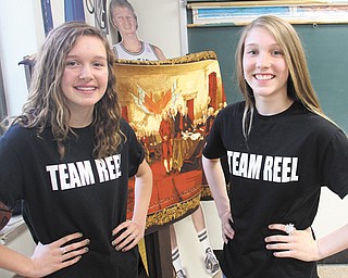 Delaney Bresnahan, left, and Emma Hartshorn, both eighth-graders at Canfield Village Middle School, created “Team Reel” T-shirts to sell in support of Ken Reel, their American History teacher who recently was diagnosed with cancer.