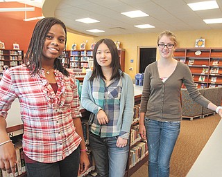 JoAnn Gernah of Nigeria, left, Yuxuan Li of China and Liane Herlitz of Germany are exchange students studying at Hubbard High School. The girls were placed by the organization Academic Year in America, which places students throughout the Youngstown area.