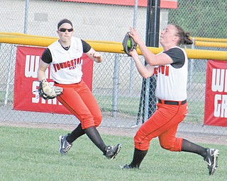 Youngstown State’s Jordan Ingalls, right, catches a pop fly with backup from Haley Thomas during the second game of Thursday’s doubleheader against the Robert Morris Colonials at McCune Park in Canfield. The Penguins lost both games, 8-0 and 12-4, respectively.