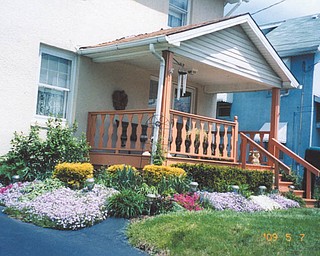 Nancy Kausits of Youngstown has put in some time with her flower garden. Photo sent in by her daughter, Autumn Kausits.