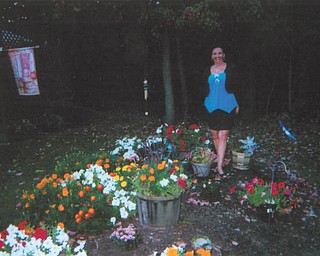 Standing amid a multitude of blooms is Deborah Carissimi of Boardman.