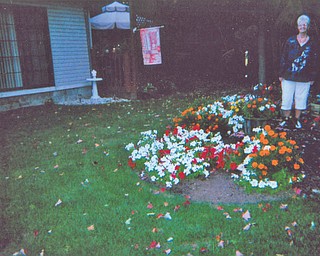 JoAnn Carissimi of Boardman shows off many-colored blossoms. Photo sent in by Deborah Carissimi of Boardman.