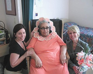 These "blossoms" at Danridge's Burgundi Manor in Youngstown are, from left, Shelly Frangos, activities; Haggir Moorer, short-term rehabilitation resident; and Toni Krager, corporate marketing director.