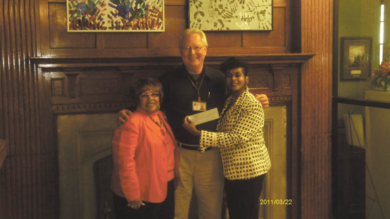 Instead of buying and exchanging gifts for one another, members of Youngstown Chapter of The Links Inc. made a donation to the Rescue Mission of Mahoning Valley. Vice President Janice Beachum, left, and President Krishmu Shipmon, right, presented the check to James Echement, executive director of the Rescue Mission. Links is an international volunteer service organization that strives to affect the quality of life through community service.