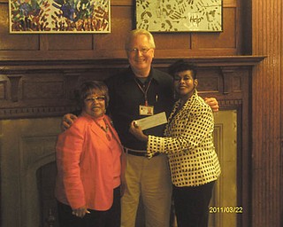 Instead of buying and exchanging gifts for one another, members of Youngstown Chapter of The Links Inc. made a donation to the Rescue Mission of Mahoning Valley. Vice President Janice Beachum, left, and President Krishmu Shipmon, right, presented the check to James Echement, executive director of the Rescue Mission. Links is an international volunteer service organization that strives to affect the quality of life through community service.