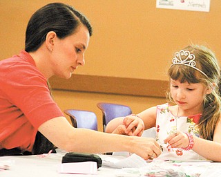 Laney and her daughter Gianna Pinciaro, 7, of Boardman make crafts at the Mommy & Me for Tea and Fashion Show at Boardman Park on Sunday.