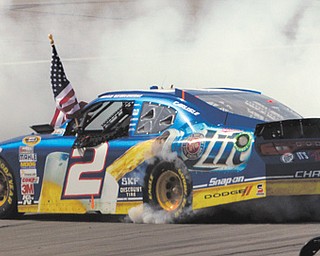 Brad Keselowski performs a burnout after winning a NASCAR Sprint Cup Series race at Talladega Superspeedway in Talladega, Ala., on Sunday.