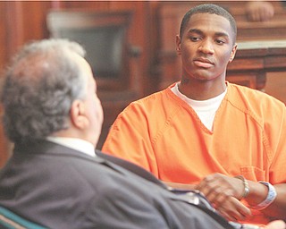 Melvin Shaw converses with his attorney Thomas Zena during a suppression hearing before Judge James C. Evans of Mahoning County Common Pleas Court. Shaw is accused of killing a 17-year-old girl and wounding her 18-year-old friend in 2010. The trial is expected to get under way today with jury selection.