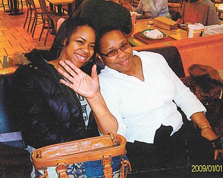 Mom Theresa Adams and daughter Patrice Adams, both of Youngstown, share a moment together. Patrice submitted a poem in honor of her mother.