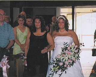 "A mom, a dad, a coach, a teacher, a fan, a supporter and most of all, a best friend" is how Jessica Hallquist describes her mother, Carol Crytzer. Both are from Struthers. Jessica says it was such an honor to have her mom walk Jessica down the aisle at her wedding.