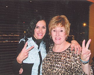 At her mother's 70th birthday party, Angela Ritz of Boardman and her mother, Katie Balale of Campbell, flash a "peace out" gesture. Angela said this about her mother's battle with breast cancer: "Cancer didn't change my mother, it just proved to me what a warrior she really is."