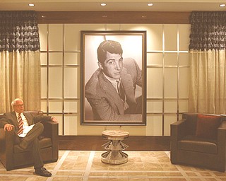 A television reporter sits in the lounge reserved for high-end gamblers during a press tour of the Horseshoe Casino Cleveland on Wednesday. The $350 million casino project is scheduled to open to the public Monday.